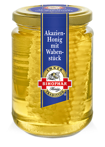 Akazienhonig mit einem natürlichen Wabenstück im Honigglas